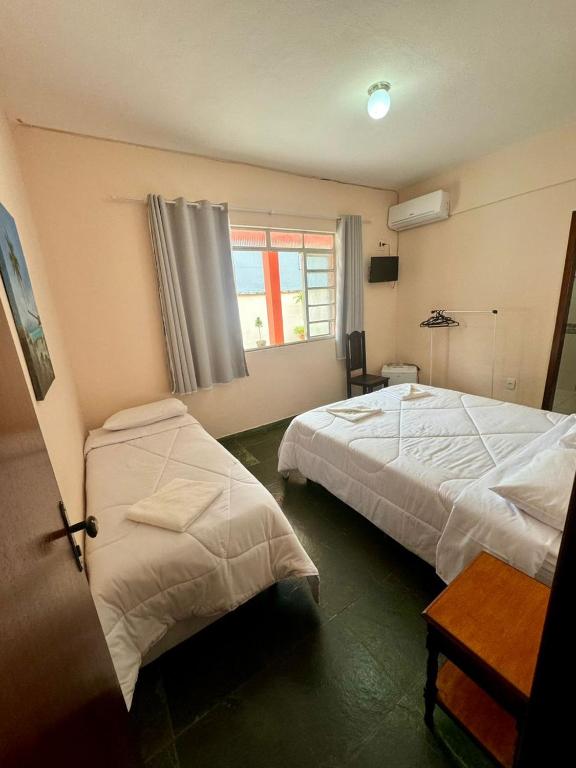 Postel nebo postele na pokoji v ubytování A S Suites