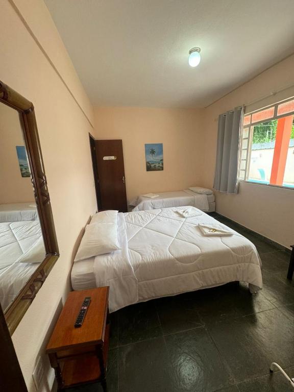 Postel nebo postele na pokoji v ubytování A S Suites