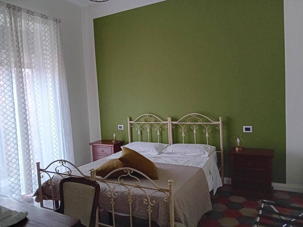 Postel nebo postele na pokoji v ubytování B&B Domus Palmi