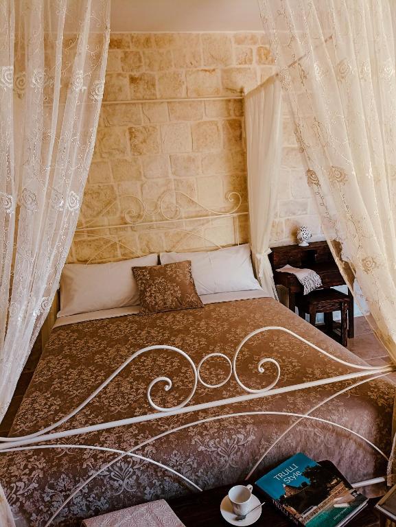 Postel nebo postele na pokoji v ubytování Masseria Cortese