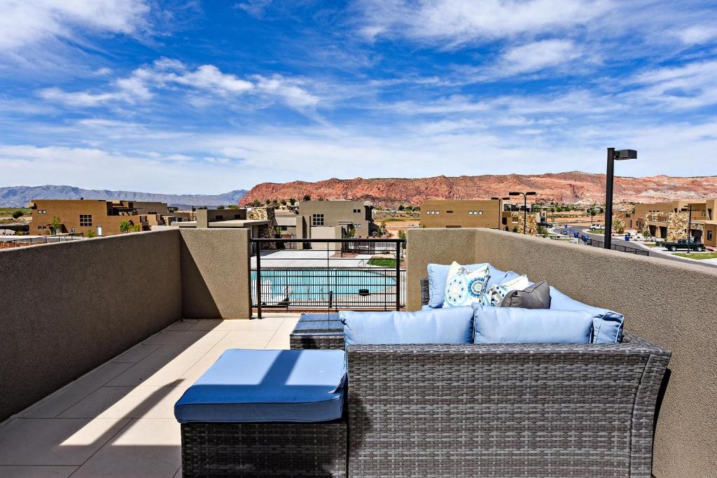 a balcony with a couch and a view of the desert at The View At The Escapes in St. George