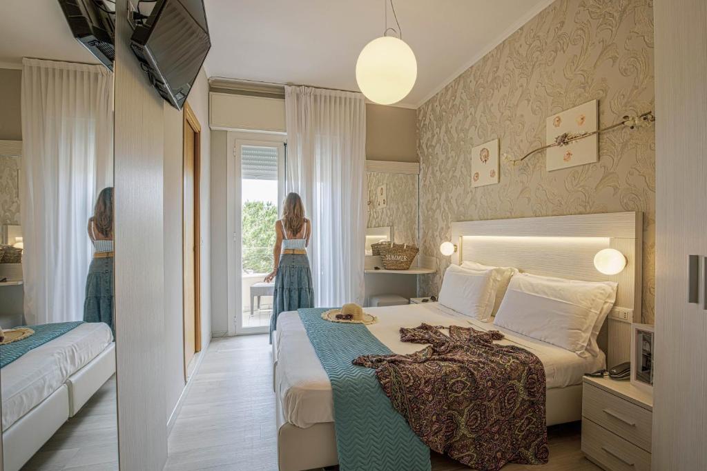 Postel nebo postele na pokoji v ubytování Hotel Ombretta Mare