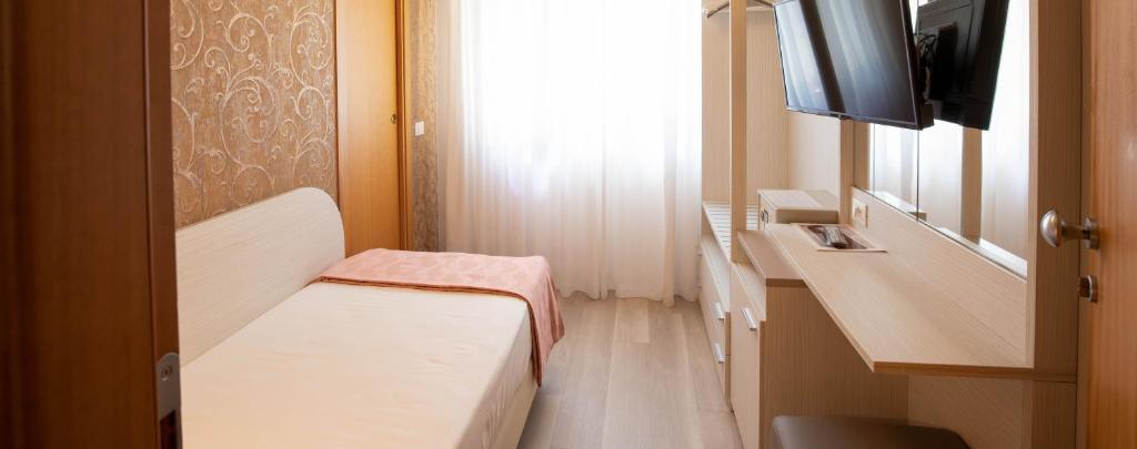 TV a/nebo společenská místnost v ubytování Hotel Ombretta Mare