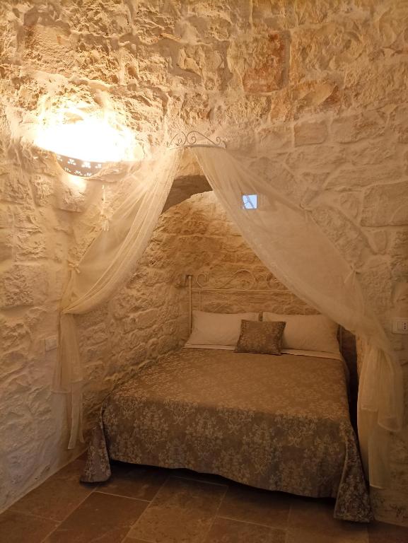 Postel nebo postele na pokoji v ubytování Masseria Cortese