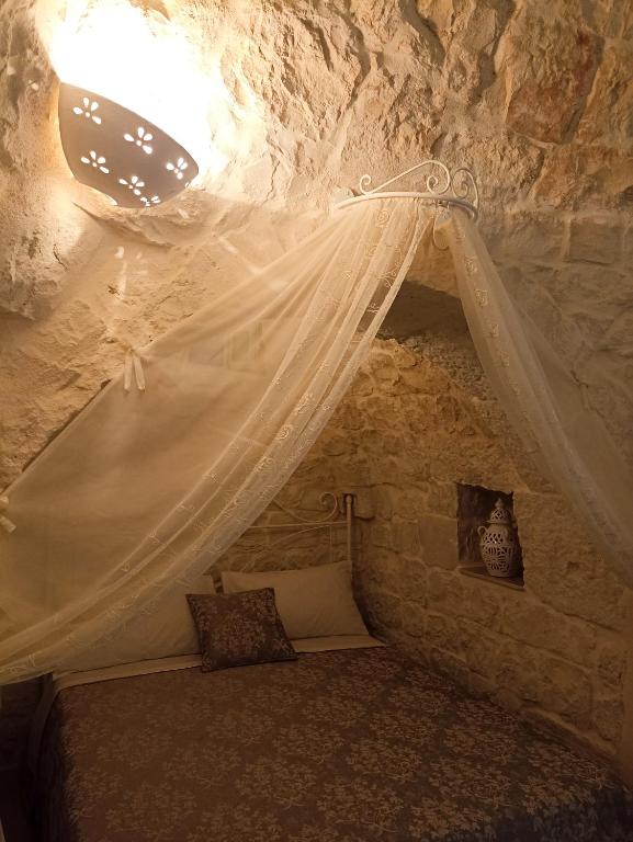 Postel nebo postele na pokoji v ubytování Masseria Cortese