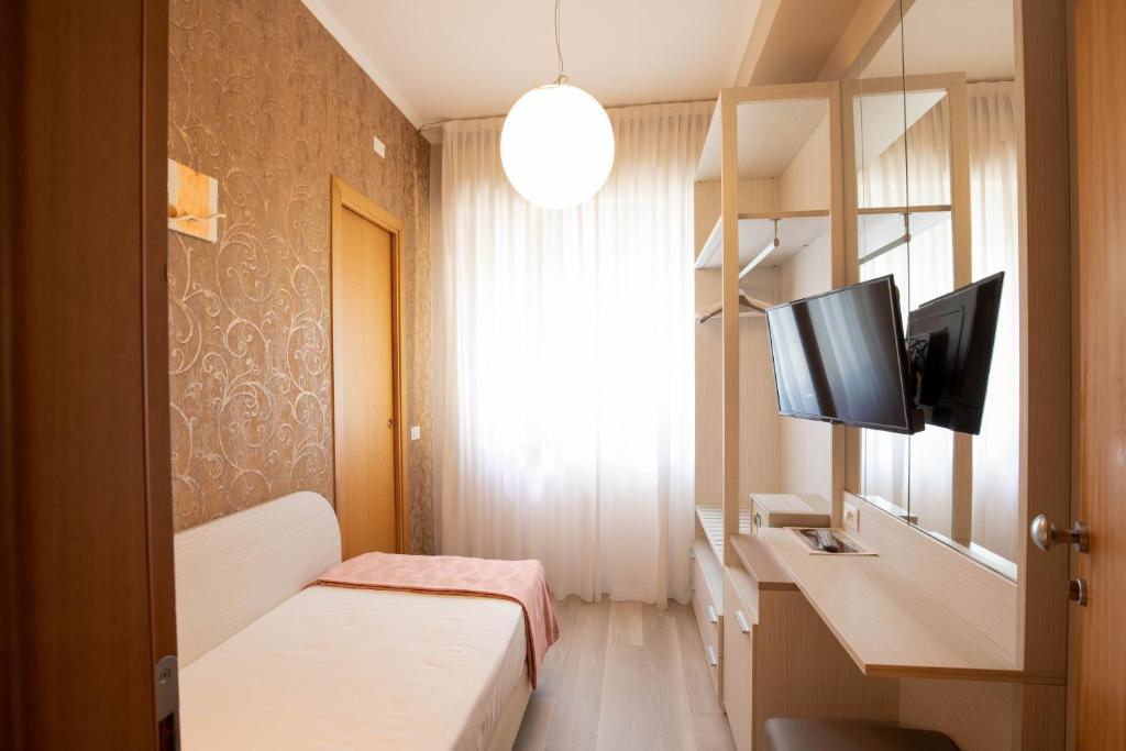 TV a/nebo společenská místnost v ubytování Hotel Ombretta Mare