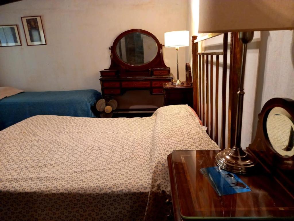 Postel nebo postele na pokoji v ubytování Hotel Posada El Recodo