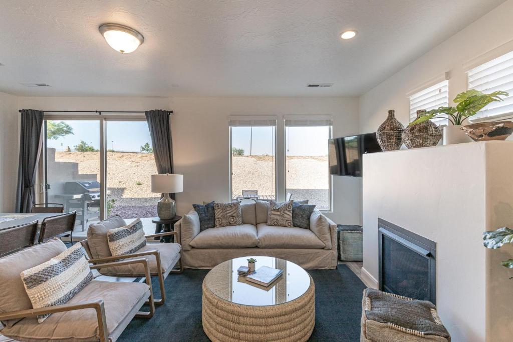 a living room with a couch and a fireplace at Hacienda Hideaway in St. George