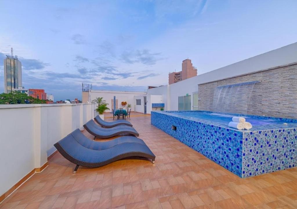 a large swimming pool on the roof of a building at Hotel Granada Real in Cali