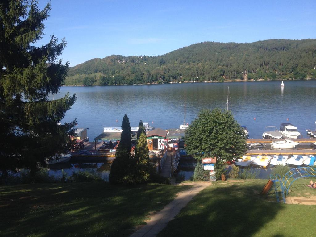 a view of a marina with boats in the water at Autocamp Skalice in Slapy