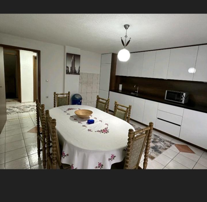a kitchen with a table with a bowl on it at A&F apartment in Pristina
