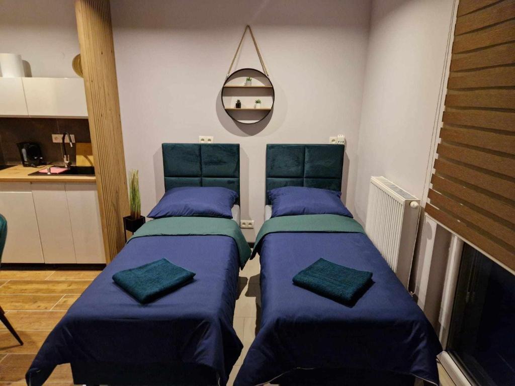 מיטה או מיטות בחדר ב-Sądowa 6