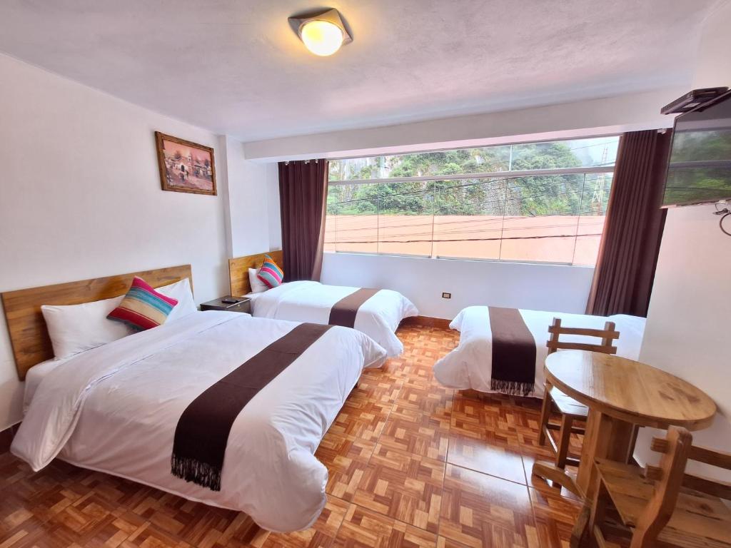 Postel nebo postele na pokoji v ubytování Mapi Gardens Machupicchu B&B
