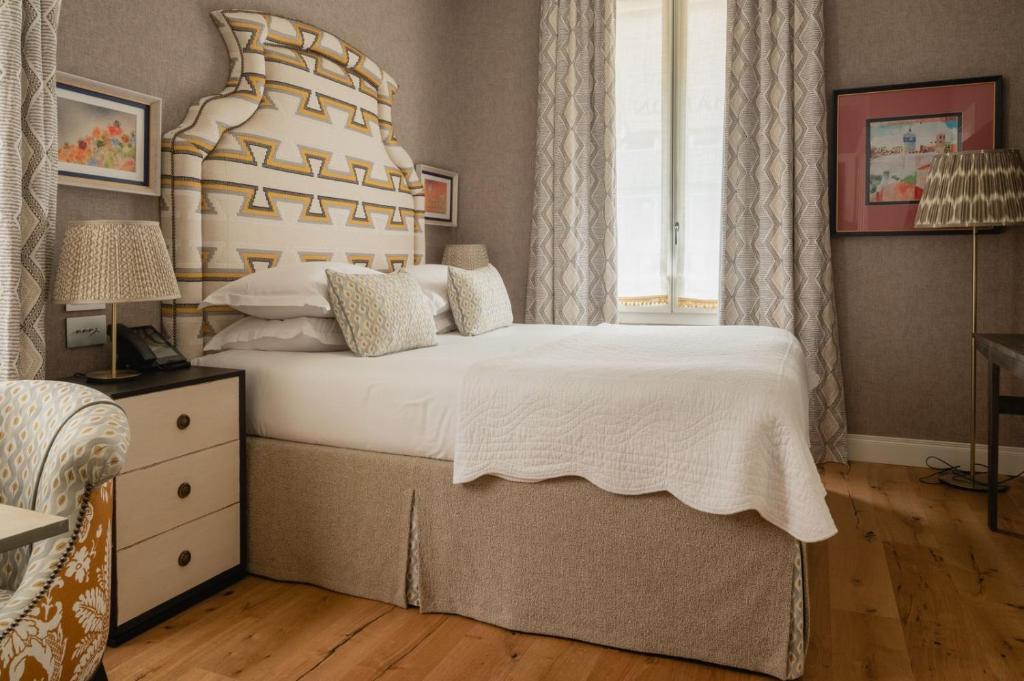 A bed or beds in a room at Vmaison Brera Milano