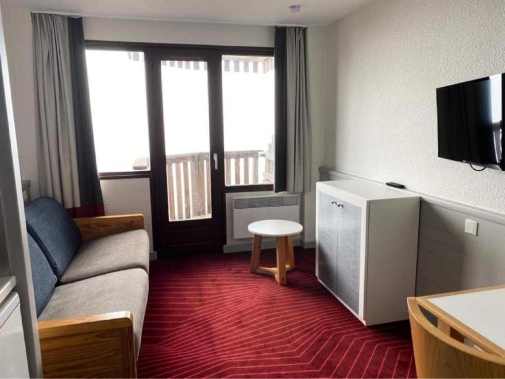 a small living room with a couch and a table at Résidence Antarès - maeva Home - Studio 4 personnes - Confort MAE-8504 in Avoriaz