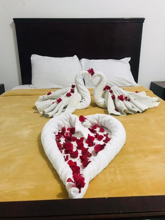 A bed or beds in a room at Nile Sunrise Flats