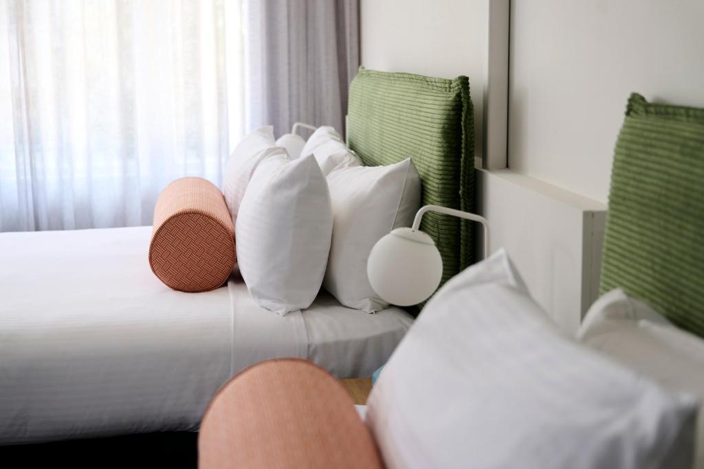 Postel nebo postele na pokoji v ubytování Baileys Parkside Motel by VetroBlu
