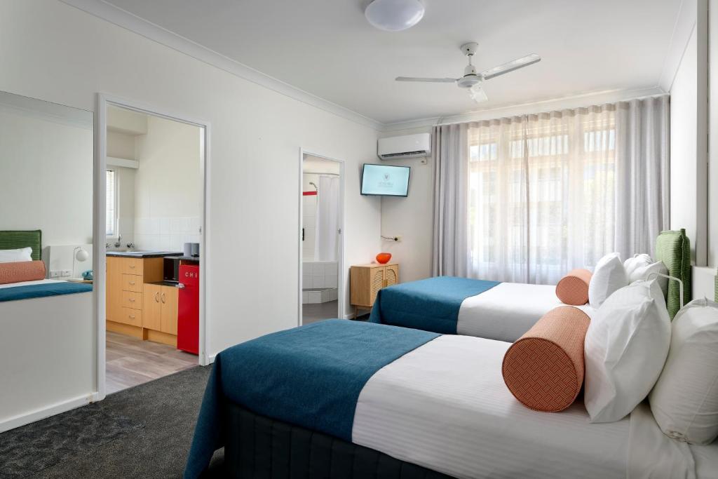 Postel nebo postele na pokoji v ubytování Baileys Parkside Motel by VetroBlu