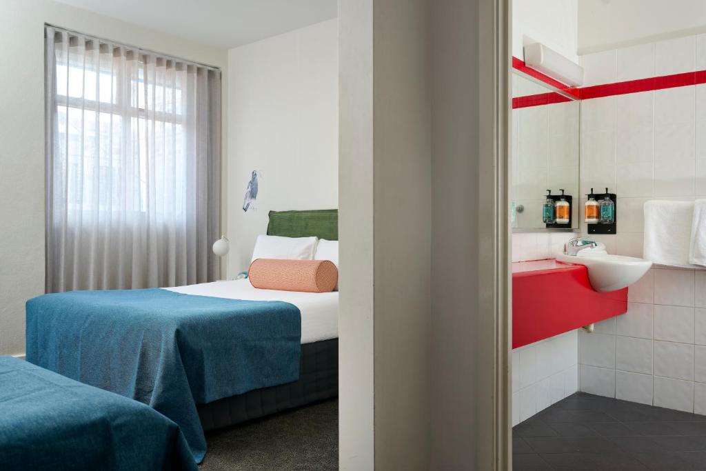 Postel nebo postele na pokoji v ubytování Baileys Parkside Motel by VetroBlu