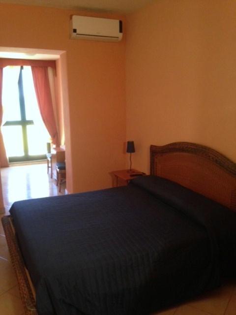 Postel nebo postele na pokoji v ubytování B Palace