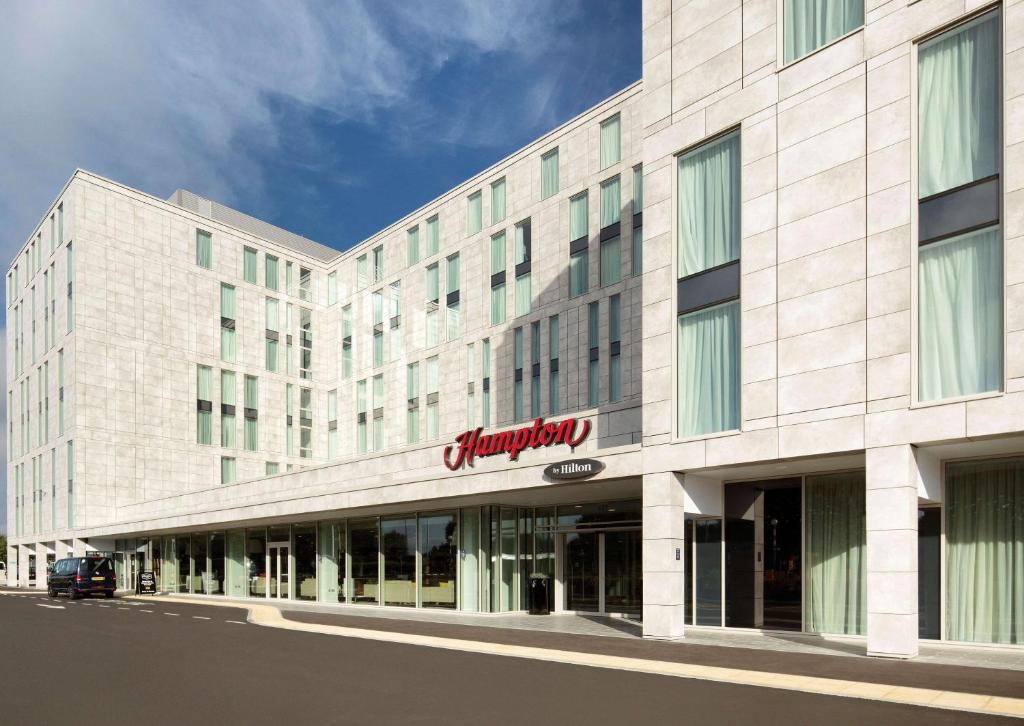 a rendering of the front of a hotel at Hampton By Hilton London Stansted Airport in Stansted Mountfitchet