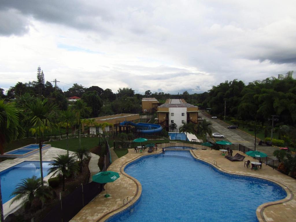 Piscina en o cerca de HERMOSO APARTAMENTO AMOBLADO PARA DESCANSO