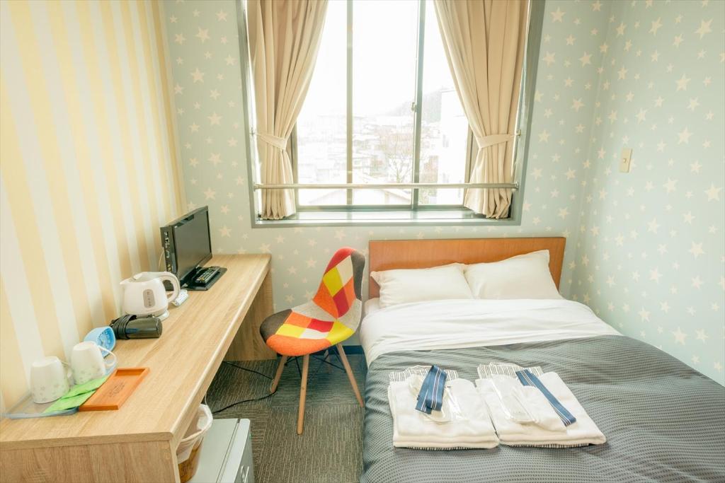 Postel nebo postele na pokoji v ubytování Hotel Ina