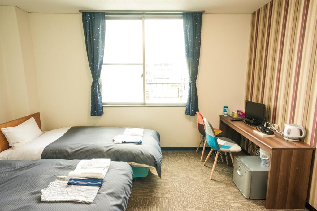 Postel nebo postele na pokoji v ubytování Hotel Ina