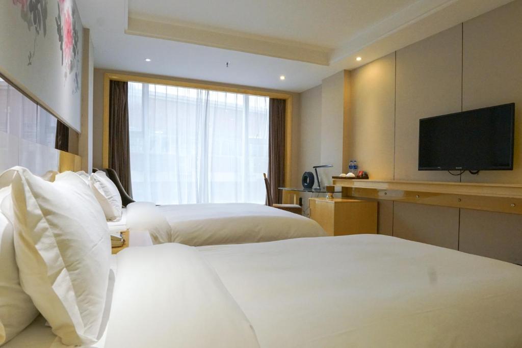 Postel nebo postele na pokoji v ubytování Paco Hotel Ouzhuang Metro Guangzhou-Free shuttle to Canton fair