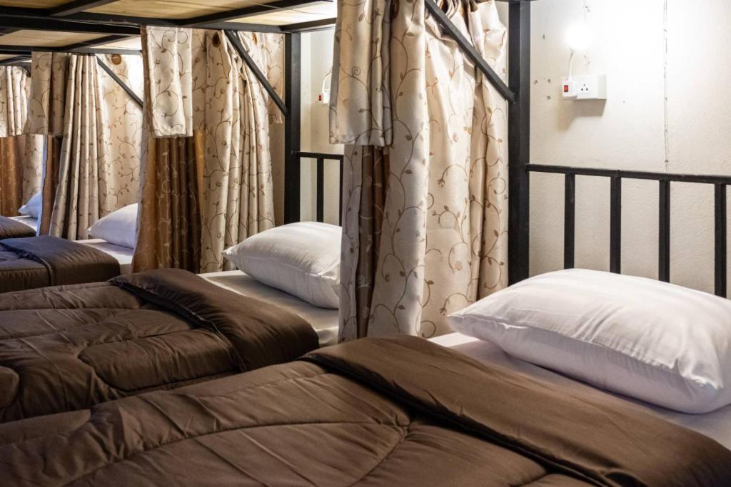 Postel nebo postele na pokoji v ubytování Hug pai hostel