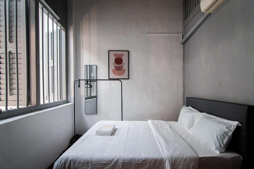 Letto o letti in una camera di Aayu Melayu George Town Penang