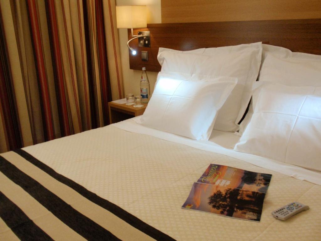 Postel nebo postele na pokoji v ubytování Hotel Principe Lisboa