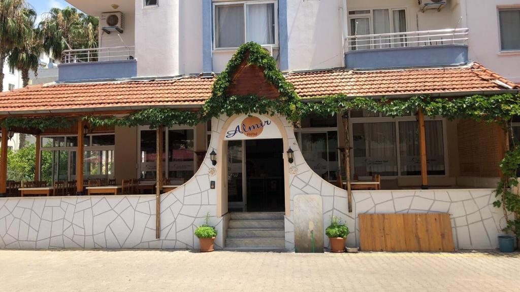 a building with a sign on the front of it at Almir Otel in Erdemli