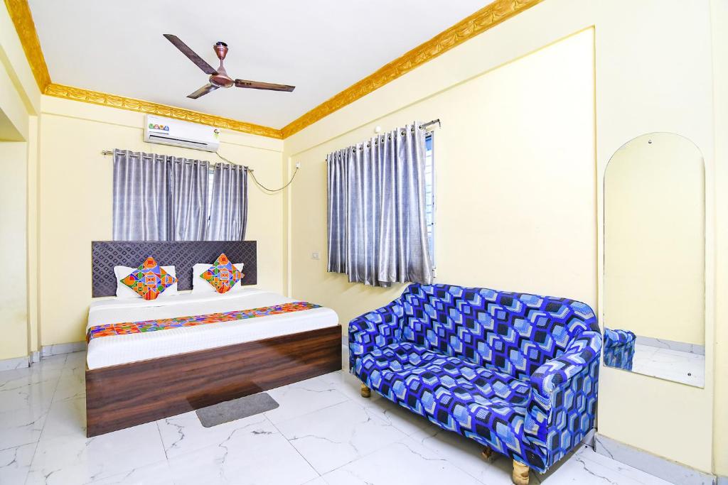 Posteľ alebo postele v izbe v ubytovaní FabHotel Narayana