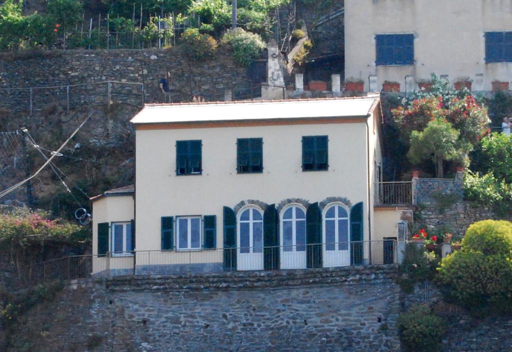 a house on the side of a hill at Il Conventino delle Cinque Terre - Sea View - AC&WiFi - Vernazzarentals in Vernazza