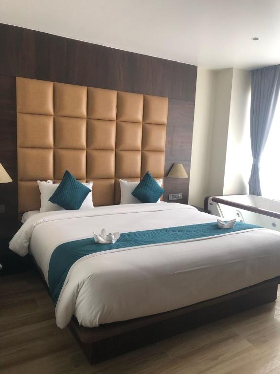Postel nebo postele na pokoji v ubytování Dees Boutique Hotel