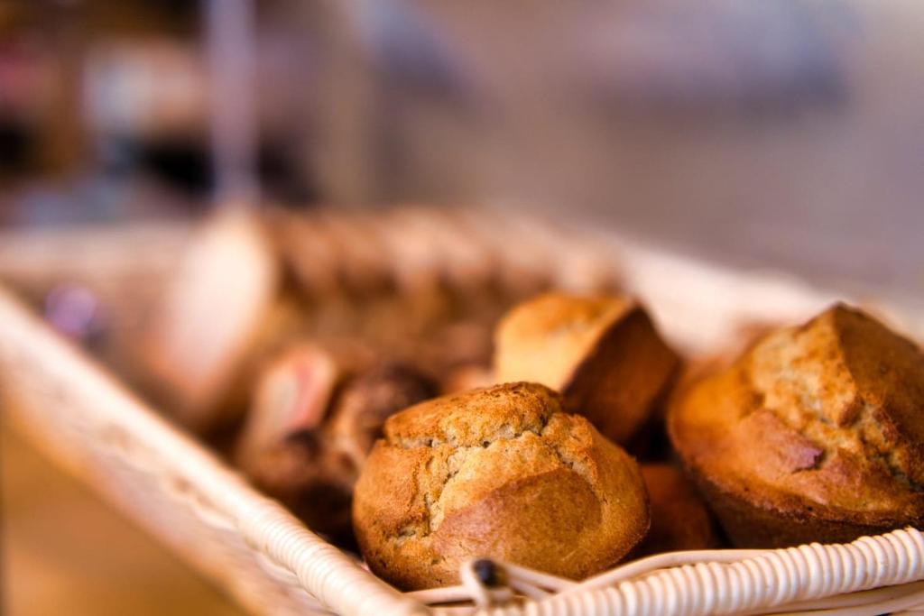 a tray filled with muffins sitting on a table at After 40 Hotel in Nairobi