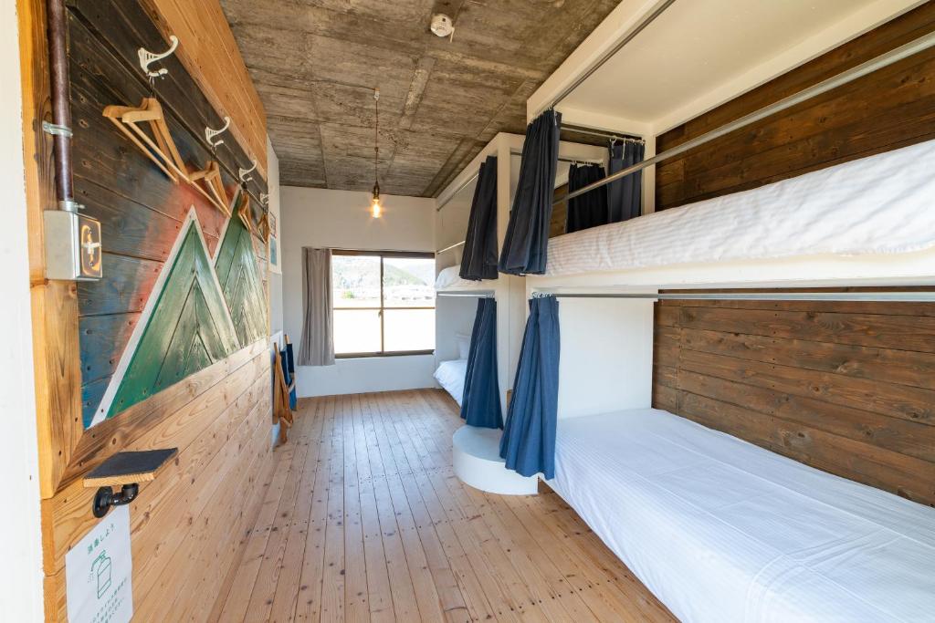 Postel nebo postele na pokoji v ubytování Ichi The Hostel