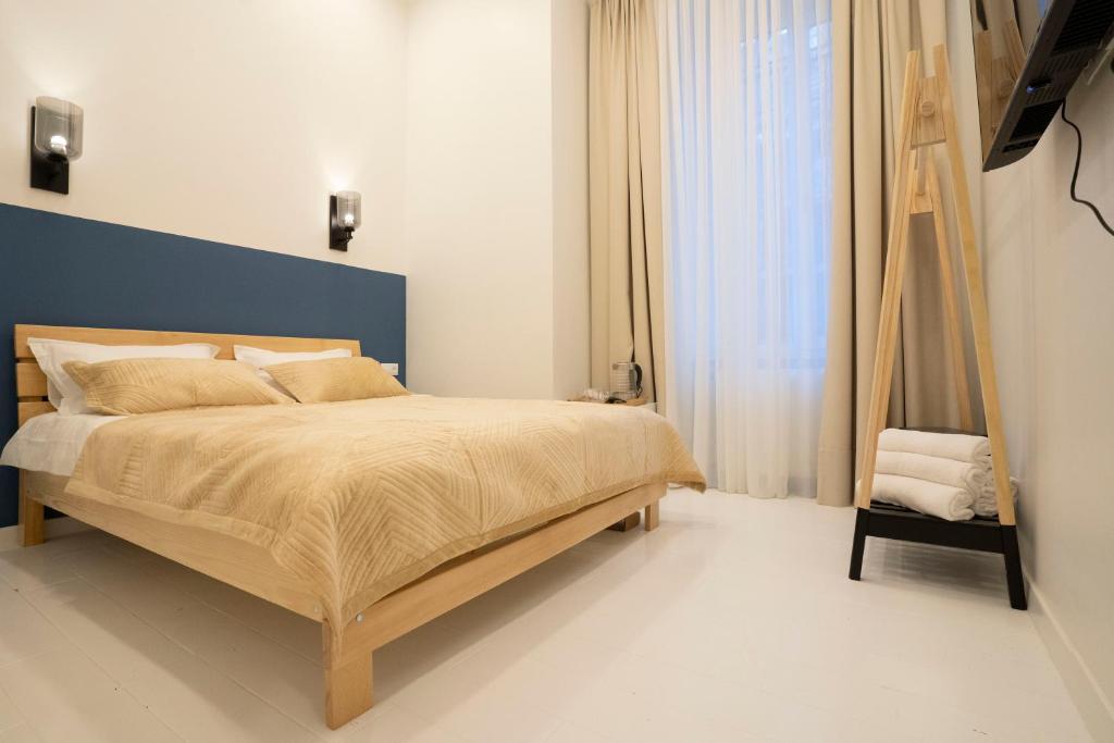 Postel nebo postele na pokoji v ubytování Sulitzer Residence