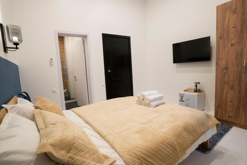 Postel nebo postele na pokoji v ubytování Sulitzer Residence