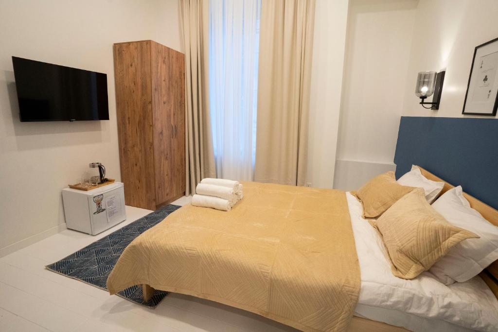 Postel nebo postele na pokoji v ubytování Sulitzer Residence