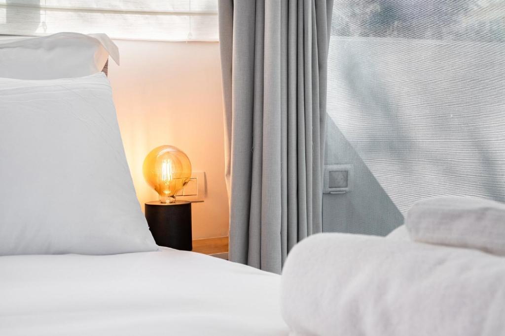 Postel nebo postele na pokoji v ubytování KG4 LUX Apartments