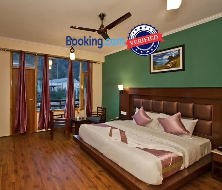 Un ou plusieurs lits dans un hébergement de l'établissement Hotel Singh