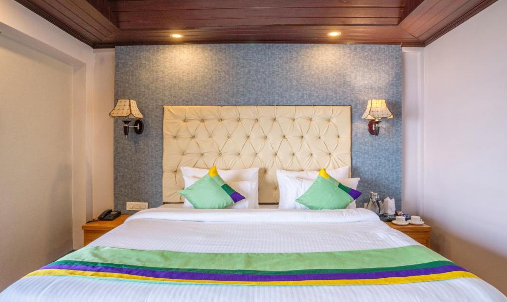 Postel nebo postele na pokoji v ubytování Treebo Eeshan Rodhi Resort, Darjeeling
