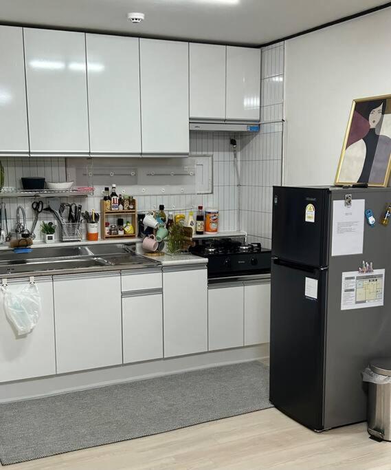 Kuchyň nebo kuchyňský kout v ubytování Homey inn Juno