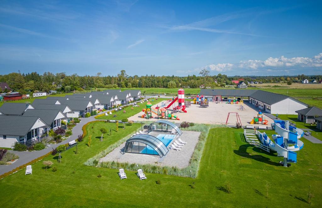 an aerial view of a park with a playground at Domki Letniskowe Biała Perła in Jezierzany