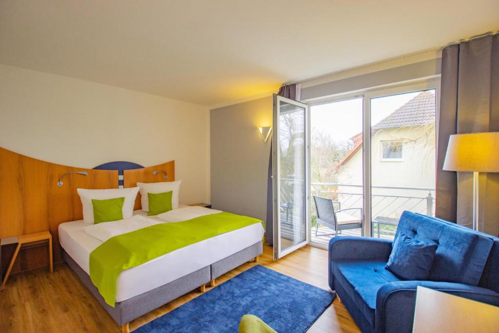 Postel nebo postele na pokoji v ubytování Inselhotel kleiner Bodden