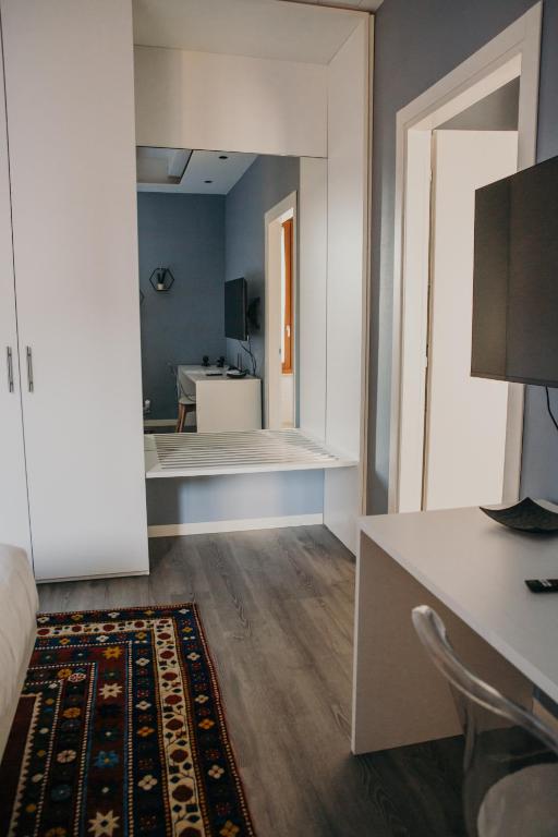TV a/nebo společenská místnost v ubytování Naboo Verona Luxury Suites