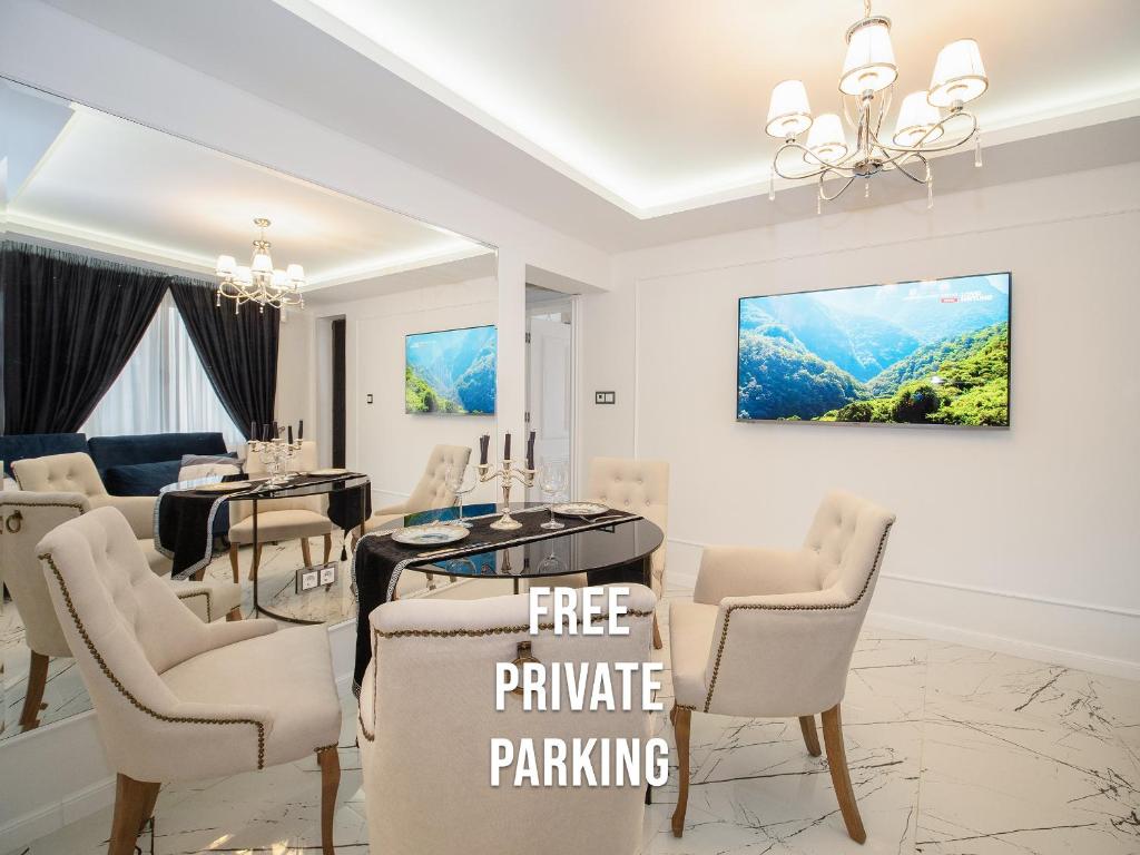a dining room with a dining table and chairs at Paradise Center Premium Suite 2 in Sofia