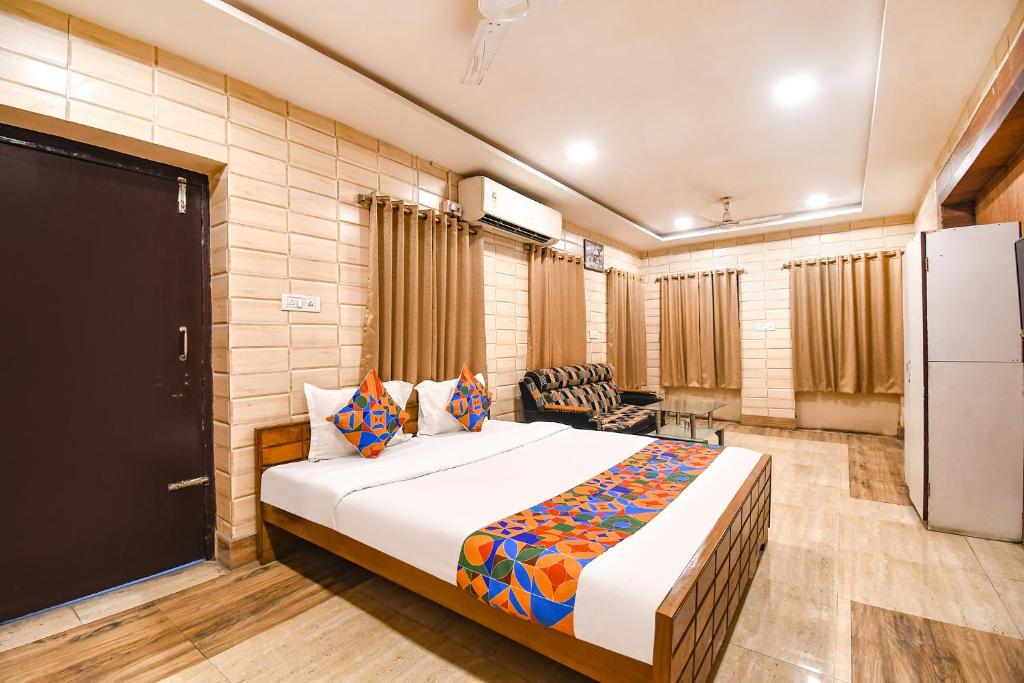 a bedroom with a large bed in a room at FabExpress Golden Stays in Kolkata